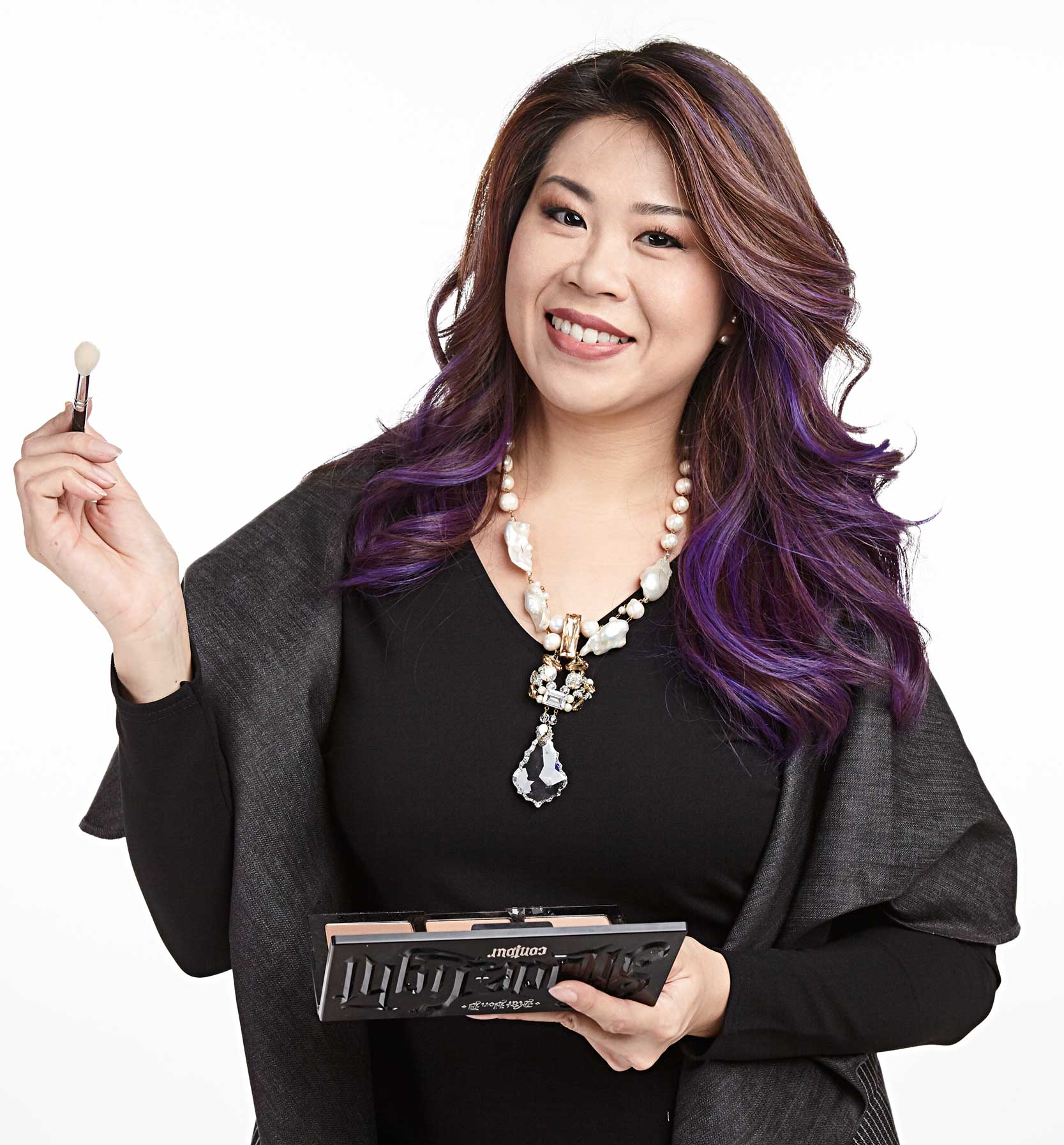 Style Coaching - Singapore - Training team member smiling with make-up brush in her hand